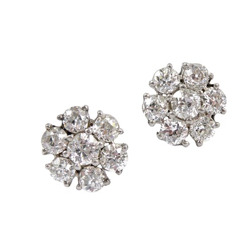 Pair of diamond cluster stud earrings, the old brilliant cut diamonds claw set in flowerhead formation,